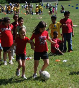 Day of sports and games at elementary school in Fairfax County, Virginia : four-legged soccer relay