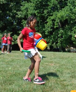 Day of sports and games at elementary school in Fairfax County, Virginia : relay game where two teams try to collect as more scattered items